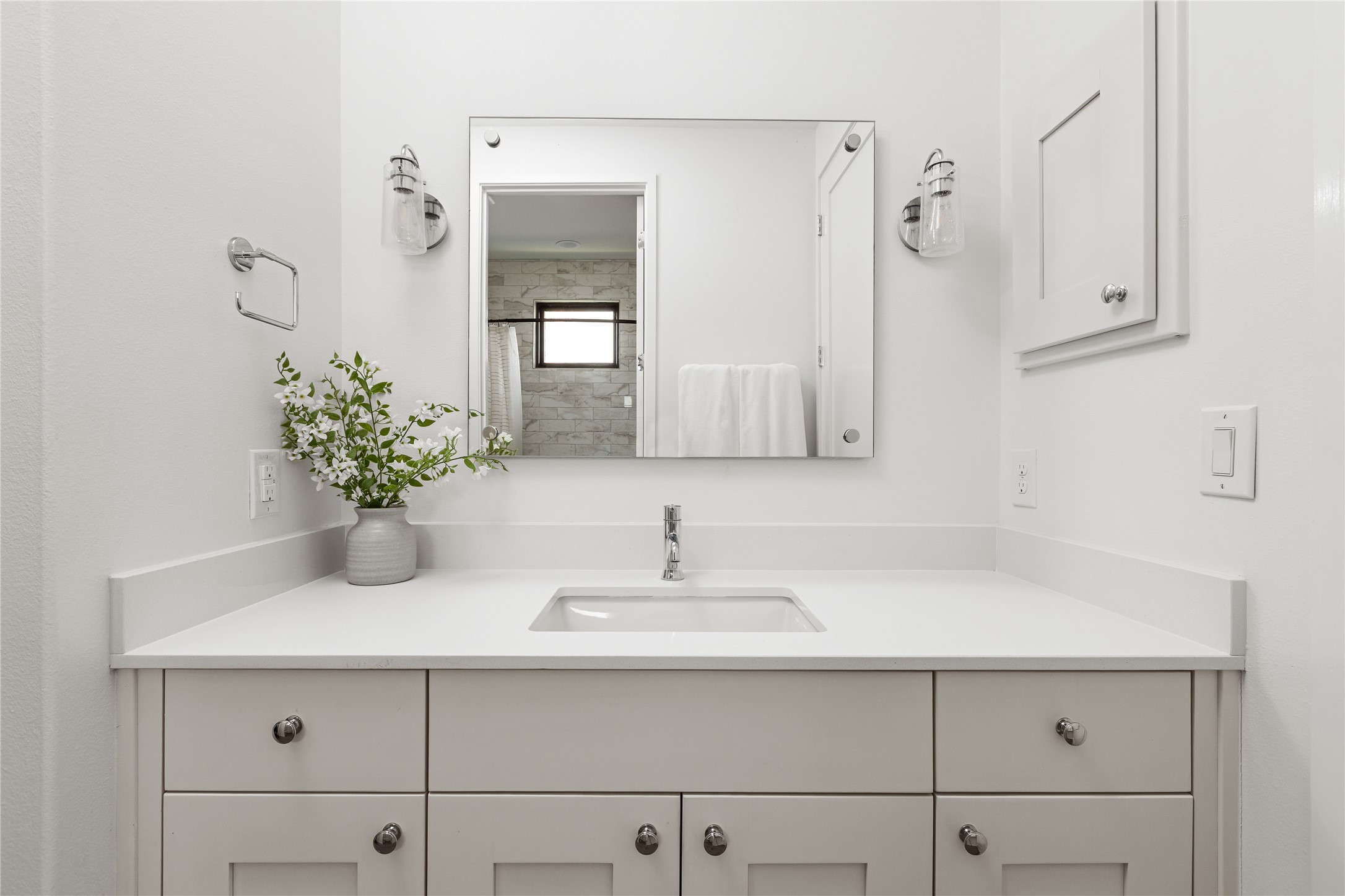 412 Kayak Way Lakeway, TX 78738 - Photo 21 of 32 a bathroom with a sink a vanity and a mirror