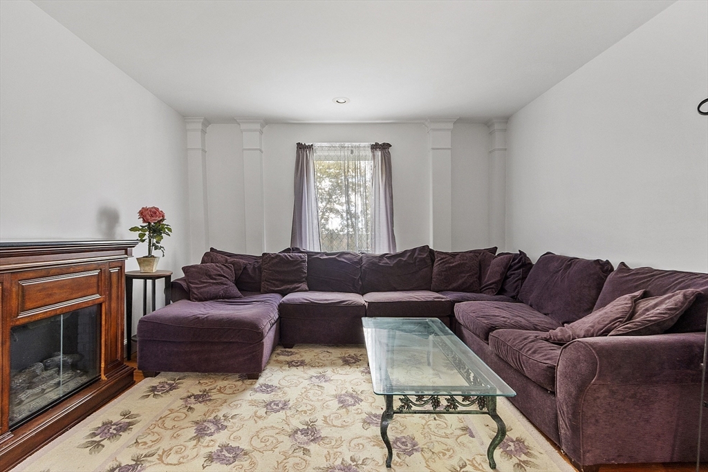 199 High Street Athol, MA 01331 - Photo 29 of 37 a living room with furniture a fireplace and a window