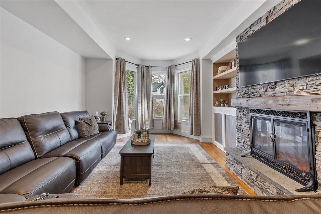 199 High Street Athol, MA 01331 - Photo 5 of 37 a living room with furniture a rug and a fireplace