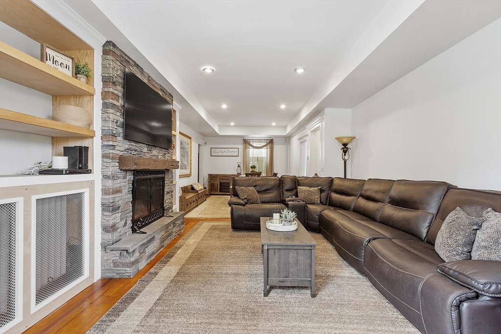 199 High Street Athol, MA 01331 - Photo 6 of 37 a living room with furniture a fireplace and a flat screen tv