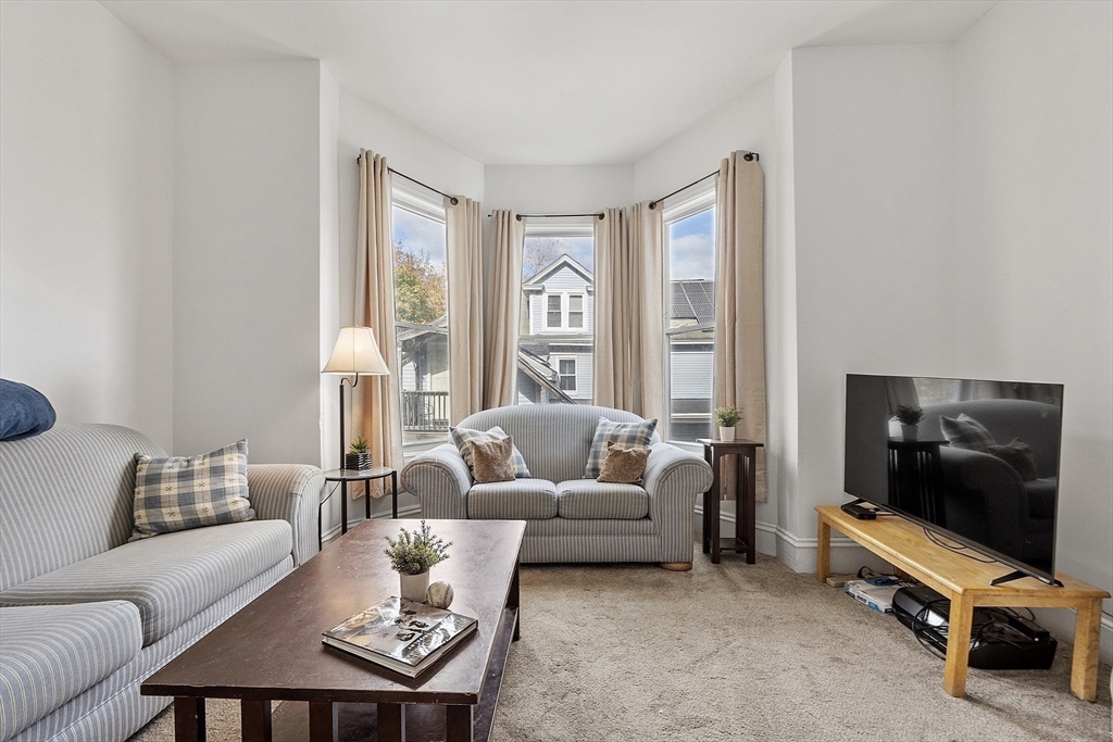 199 High Street Athol, MA 01331 - Photo 9 of 37 a living room with furniture a flat screen tv and a window