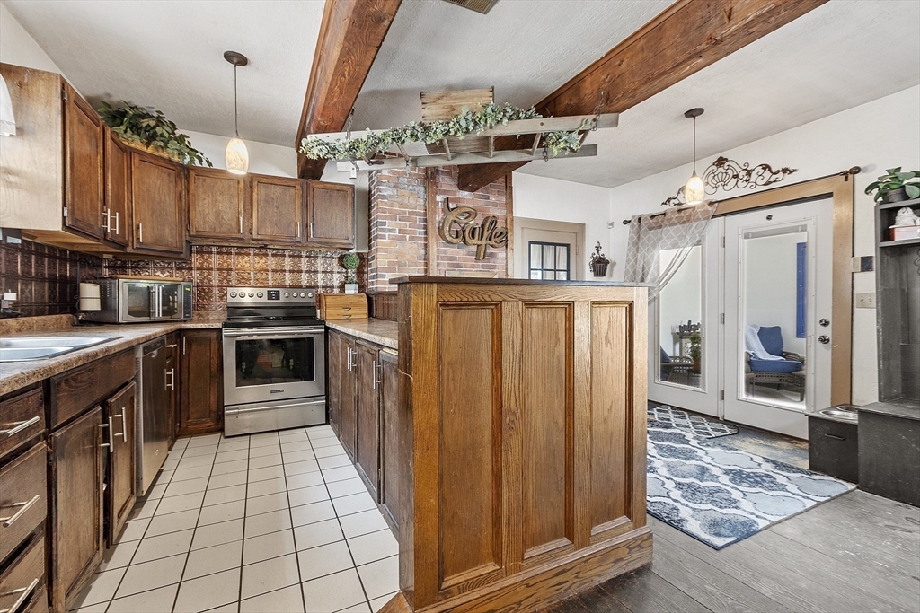 199 High Street Athol, MA 01331 - Photo 10 of 37 a open kitchen with stainless steel appliances granite countertop a stove a sink dishwasher and cabinets with wooden floor