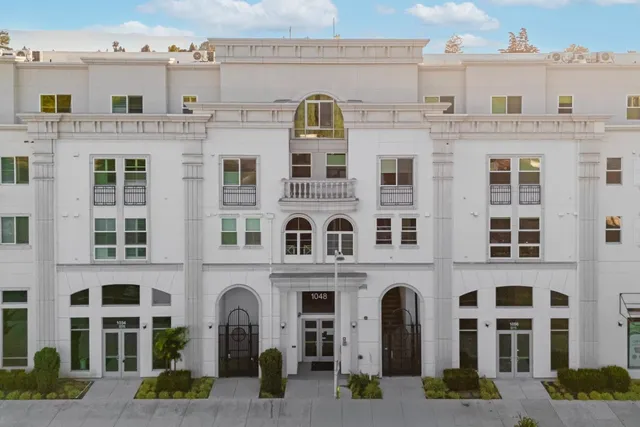 a front view of a building with glass windows