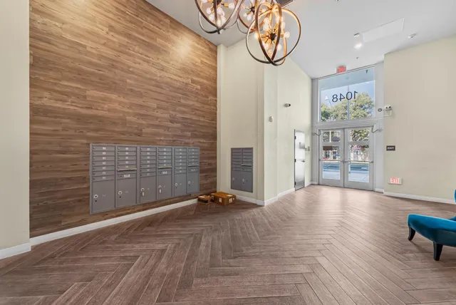 a view of an entryway with wooden floor