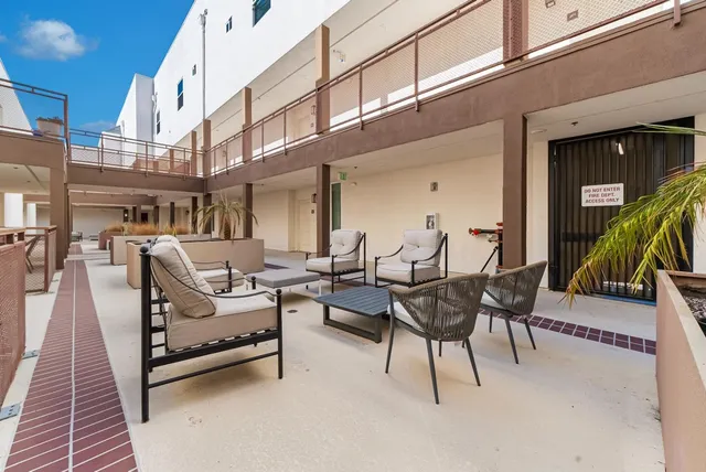 a building outdoor space with lots of tables and chairs