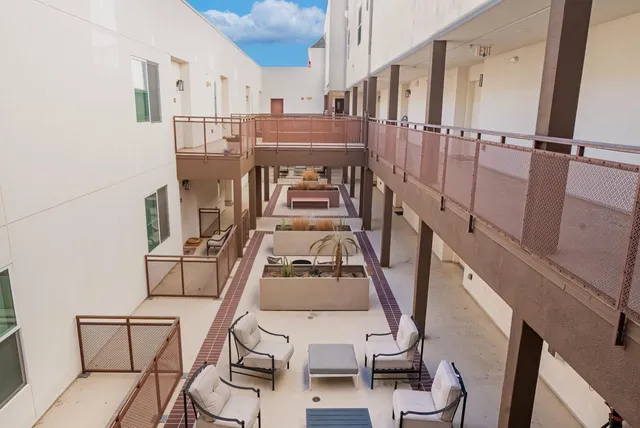 a view of balcony with furniture