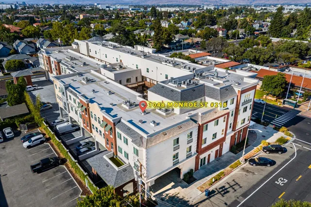 an aerial view of a building with street