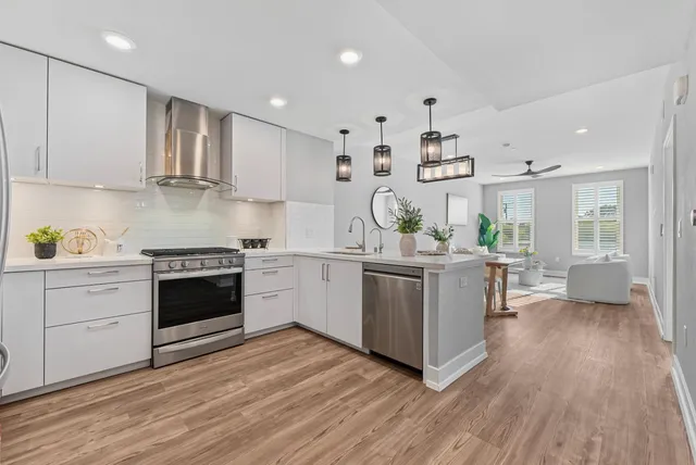 a kitchen with a white cabinets and counter space