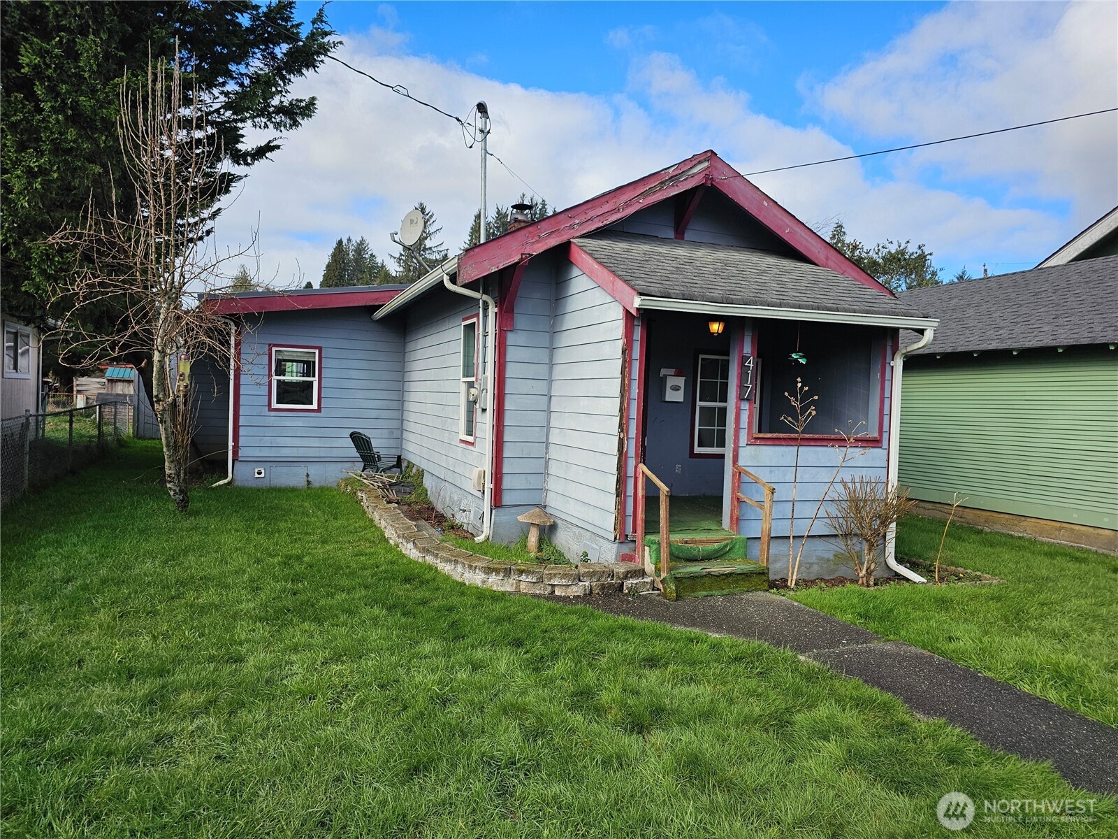 417 Monroe Street Hoquiam, WA 98550 - Photo 1 of 27 a front view of a house with a garden and yard