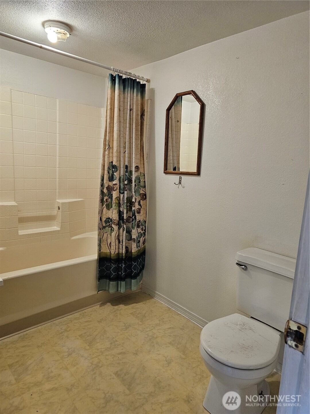 417 Monroe Street Hoquiam, WA 98550 - Photo 15 of 27 a bathroom with a toilet and a shower