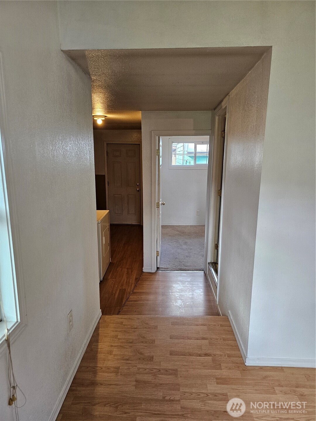 417 Monroe Street Hoquiam, WA 98550 - Photo 16 of 27 a view of hallway with wooden floor