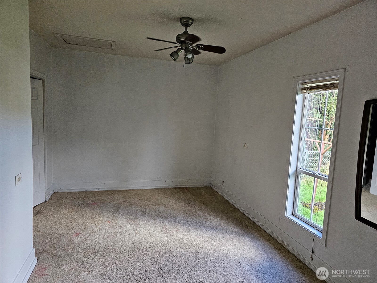 417 Monroe Street Hoquiam, WA 98550 - Photo 10 of 27 wooden floor in an empty room with a window