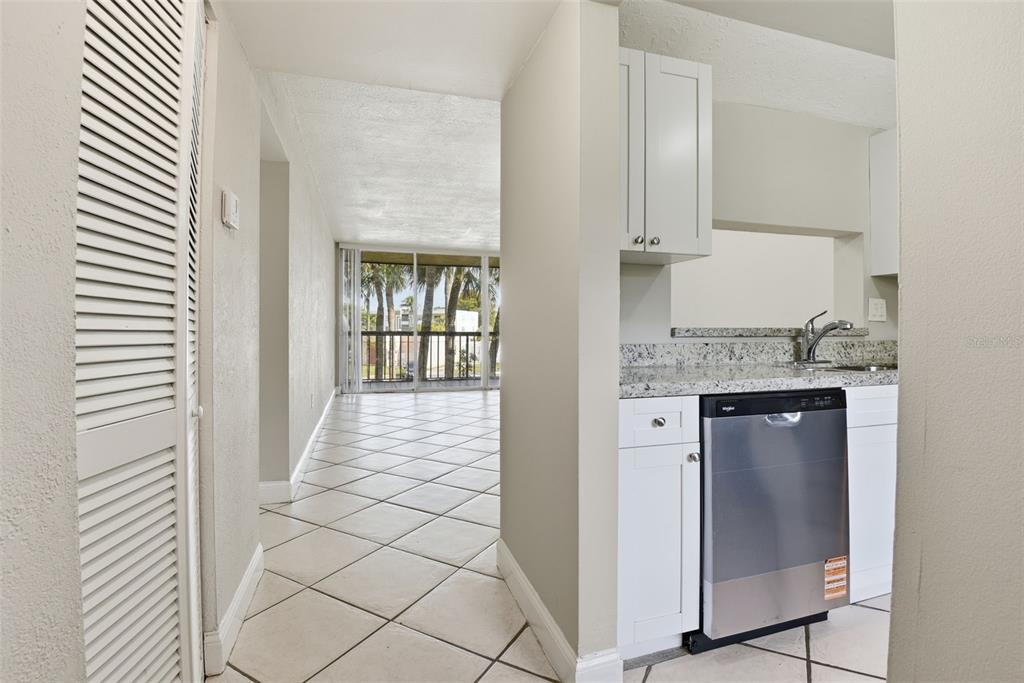 10875 Southwest 112th Avenue, Unit 202 Miami, FL 33176 - Photo 17 of 26 a view of a kitchen with granite countertop white cabinets and stainless steel appliances