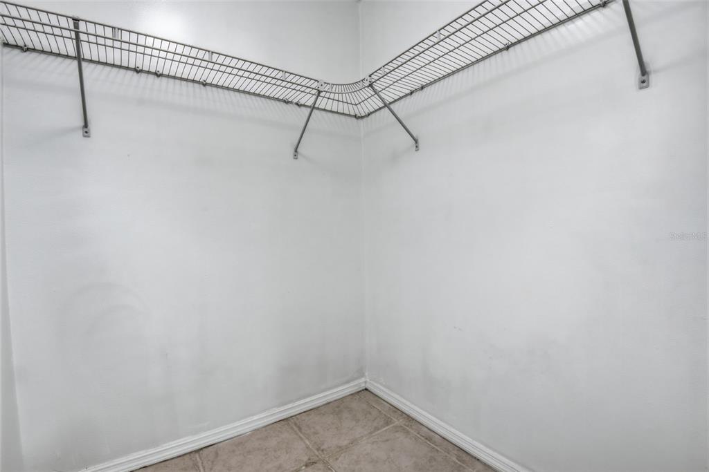 10875 Southwest 112th Avenue, Unit 202 Miami, FL 33176 - Photo 20 of 26 a view of a room with racks on the wall