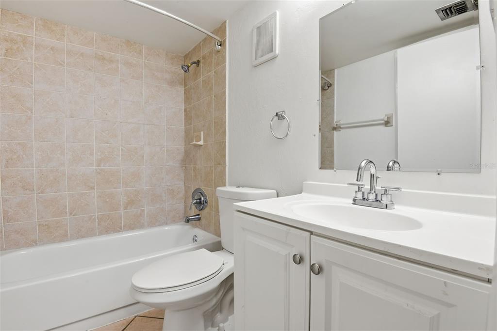 10875 Southwest 112th Avenue, Unit 202 Miami, FL 33176 - Photo 22 of 26 a bathroom with a sink a toilet and a bathtub