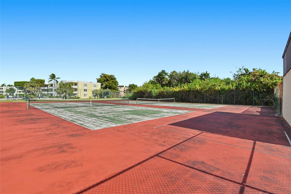 10875 Southwest 112th Avenue, Unit 202 Miami, FL 33176 - Photo 25 of 26 a view of a tennis court