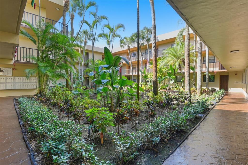 10875 Southwest 112th Avenue, Unit 202 Miami, FL 33176 - Photo 3 of 26 a view of a garden with plants