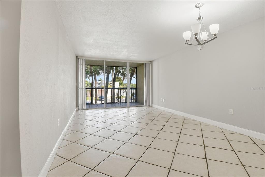 10875 Southwest 112th Avenue, Unit 202 Miami, FL 33176 - Photo 6 of 26 a view of an empty room with a window