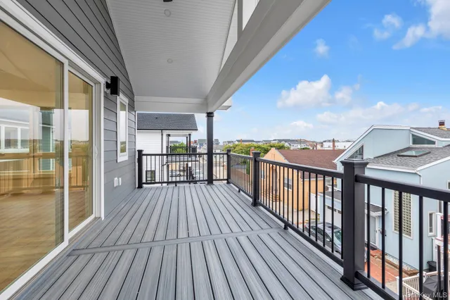 a view of a balcony with wooden floor