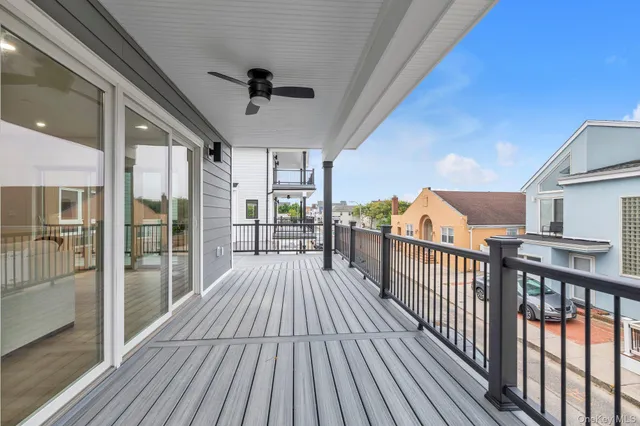 a view of a porch with wooden floor