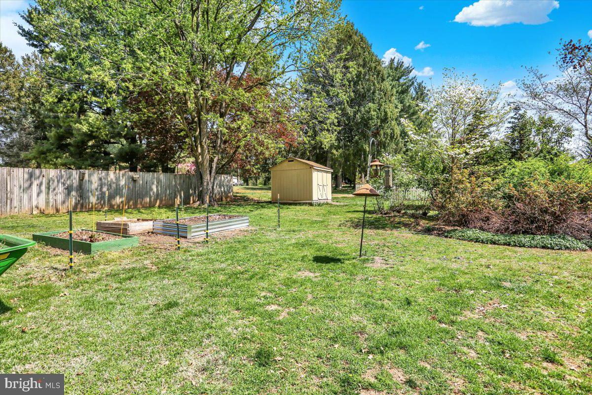 3401 Eisenbrown Road Reading, PA 19605 - Photo 8 of 44 a swimming pool with lots of green space and trees in the background