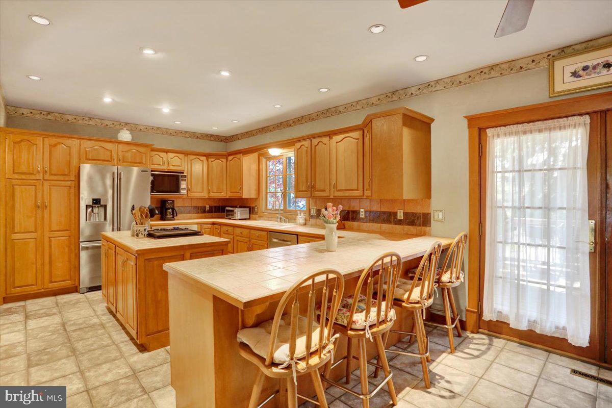 3401 Eisenbrown Road Reading, PA 19605 - Photo 9 of 44 a large kitchen with lots of counter top space and stainless steel appliances