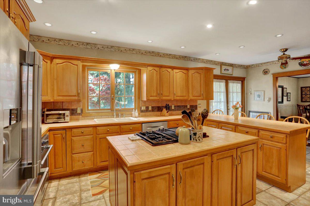 3401 Eisenbrown Road Reading, PA 19605 - Photo 10 of 44 a kitchen with stainless steel appliances granite countertop a sink a stove and a refrigerator
