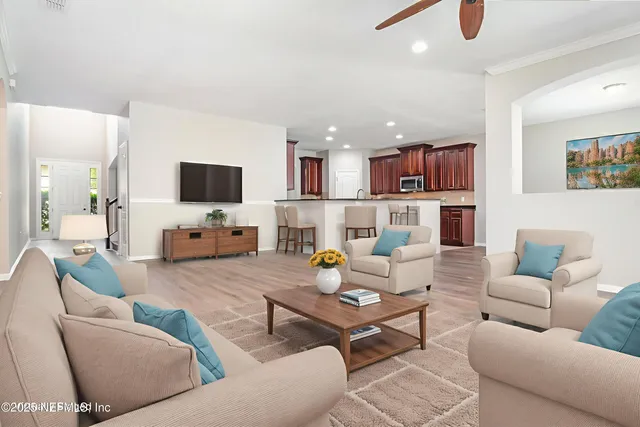 a living room with furniture and a flat screen tv