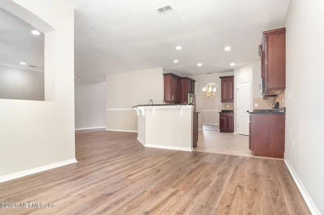 a view of kitchen with wooden floor