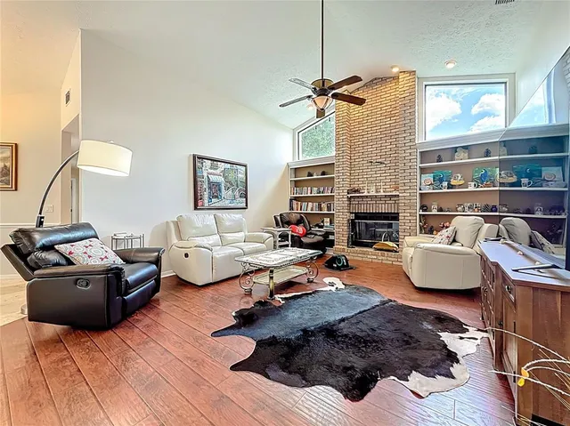 a kitchen with stainless steel appliances kitchen island granite countertop a refrigerator and microwave