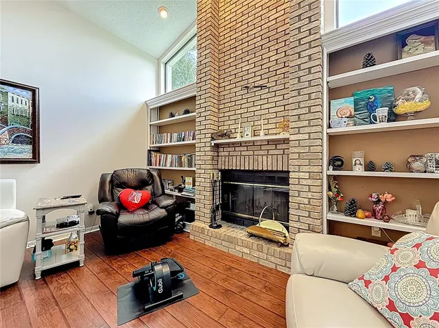 a bathroom with a granite countertop sink a mirror and a shower