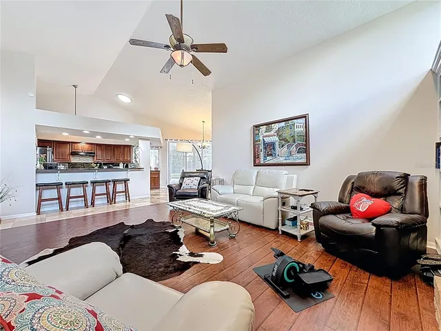 a bathroom with a tub and a painting on the wall