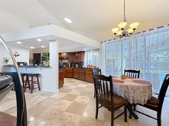 a bathroom with a granite countertop double vanity sink mirror and shower