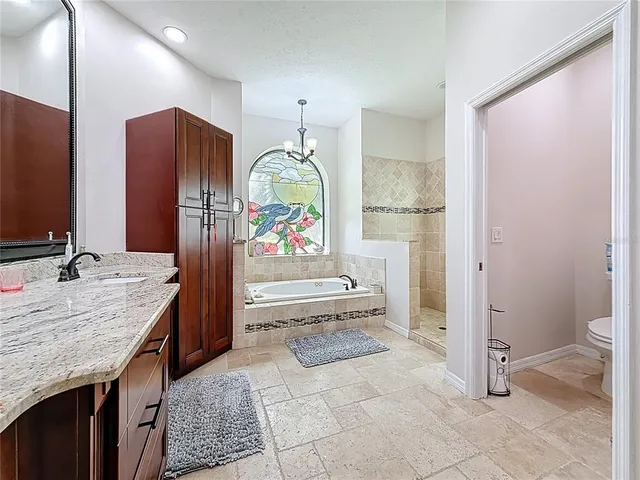 a view of a house with a backyard porch and sitting area