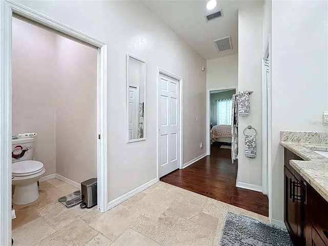 a view of a backyard with large trees