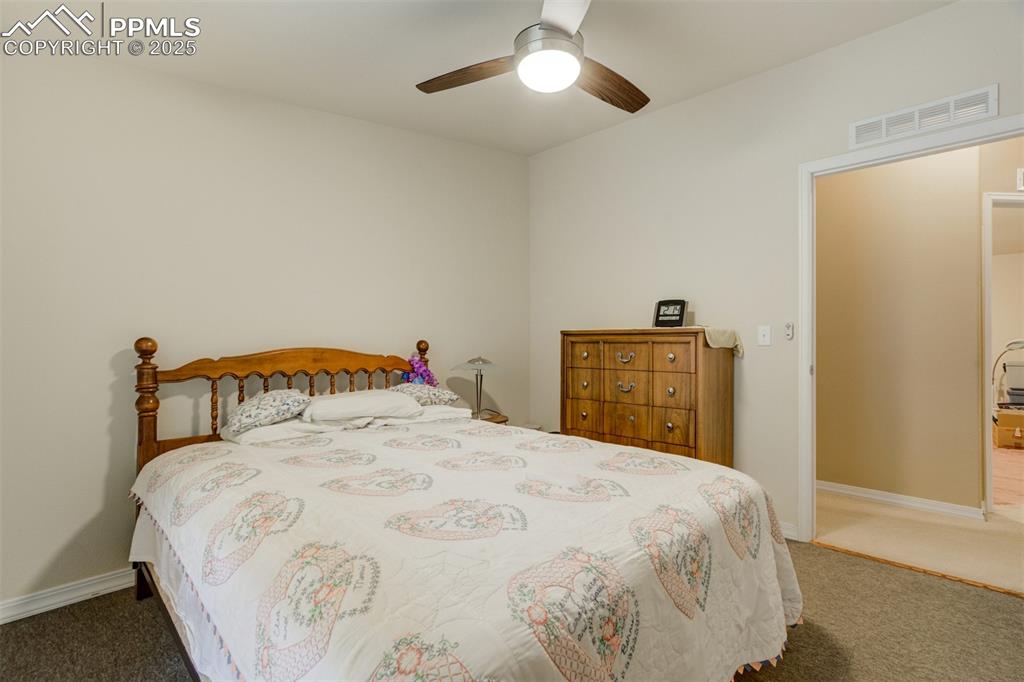 22038 County Road 2 Rush, CO 80833 - Photo 28 of 50 Carpeted bedroom featuring baseboards, visible vents, and a ceiling fan