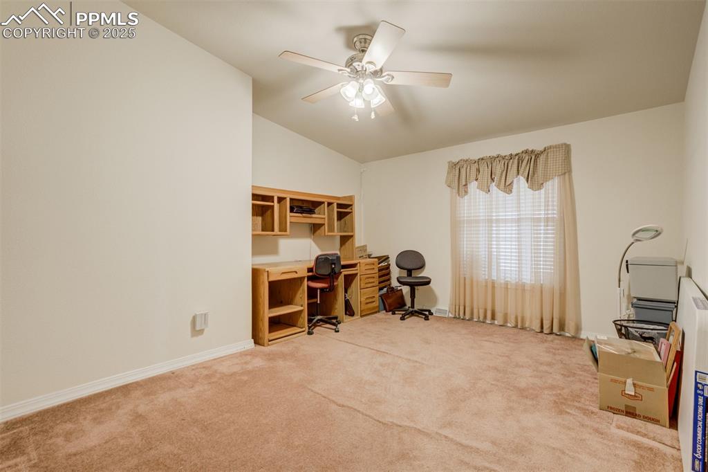 22038 County Road 2 Rush, CO 80833 - Photo 31 of 50 Home office with baseboards, carpet floors, ceiling fan, and lofted ceiling