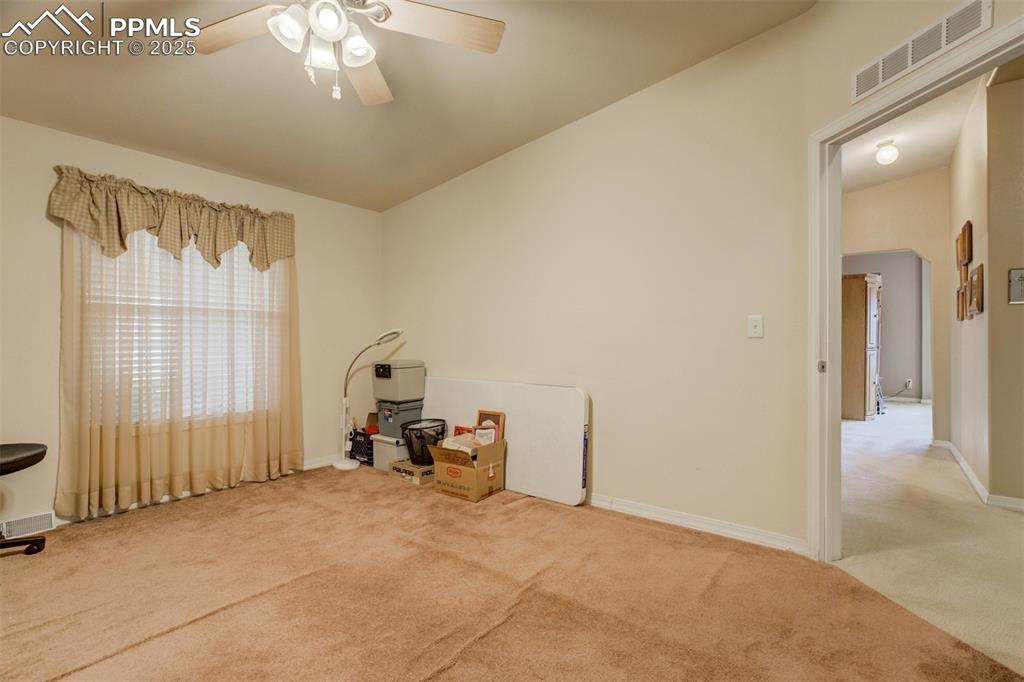 22038 County Road 2 Rush, CO 80833 - Photo 32 of 50 Misc room featuring baseboards, carpet flooring, ceiling fan, and visible vents