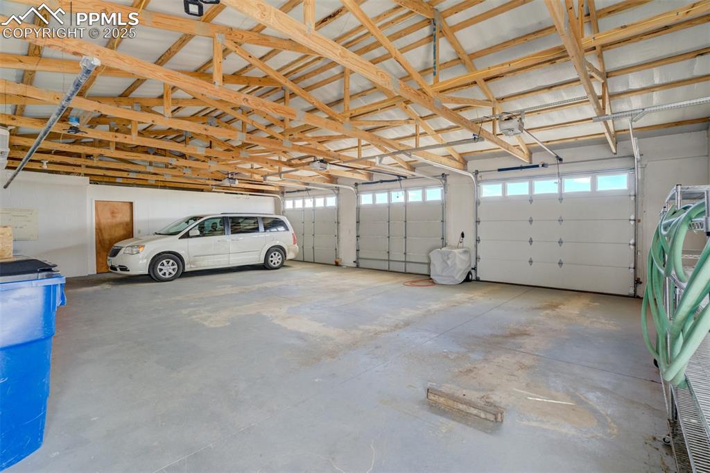 22038 County Road 2 Rush, CO 80833 - Photo 46 of 50 Garage with a garage door opener