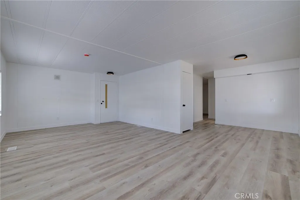 3700 Buchanan Street, Unit 164 Riverside, CA 92503 - Photo 6 of 40 a view of an empty room with wooden floor