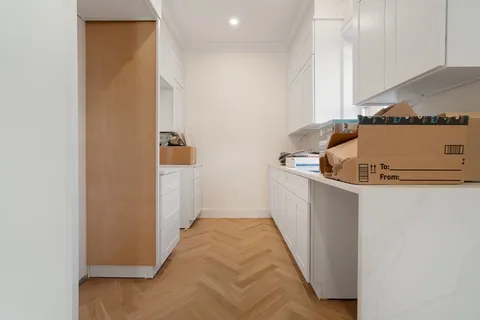 a view of a kitchen from the hallway