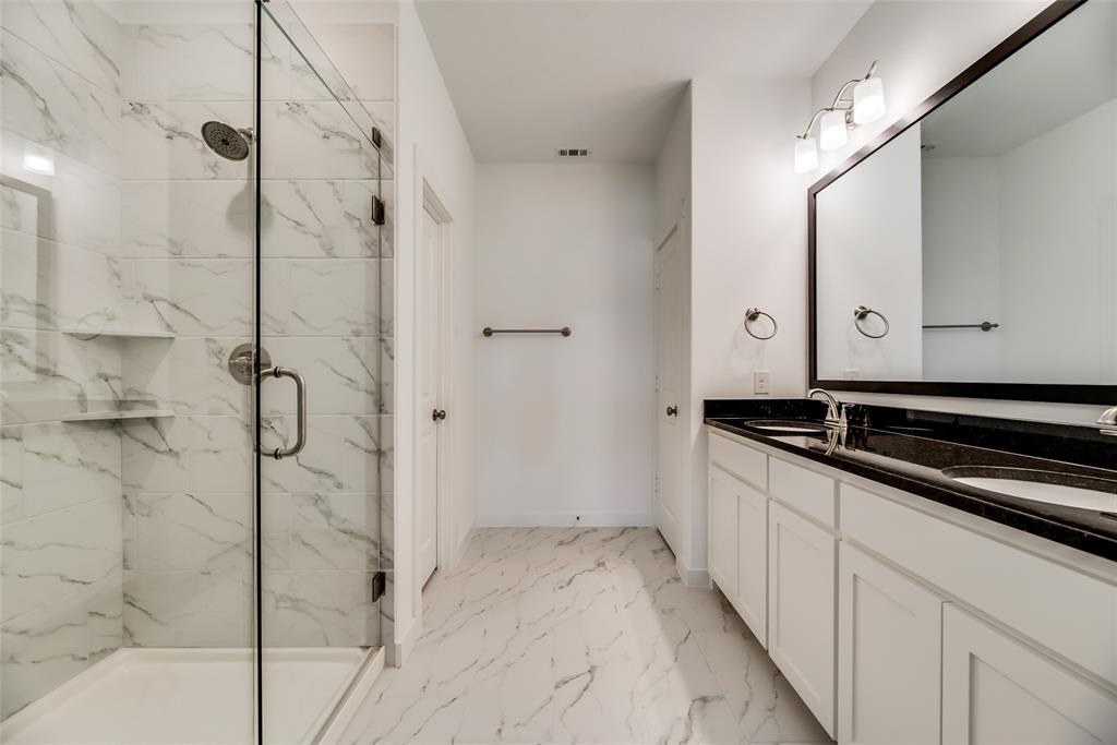 1366 Madison Avenue Flower Mound, TX 75028 - Photo 13 of 19 a bathroom with a bathtub and a shower