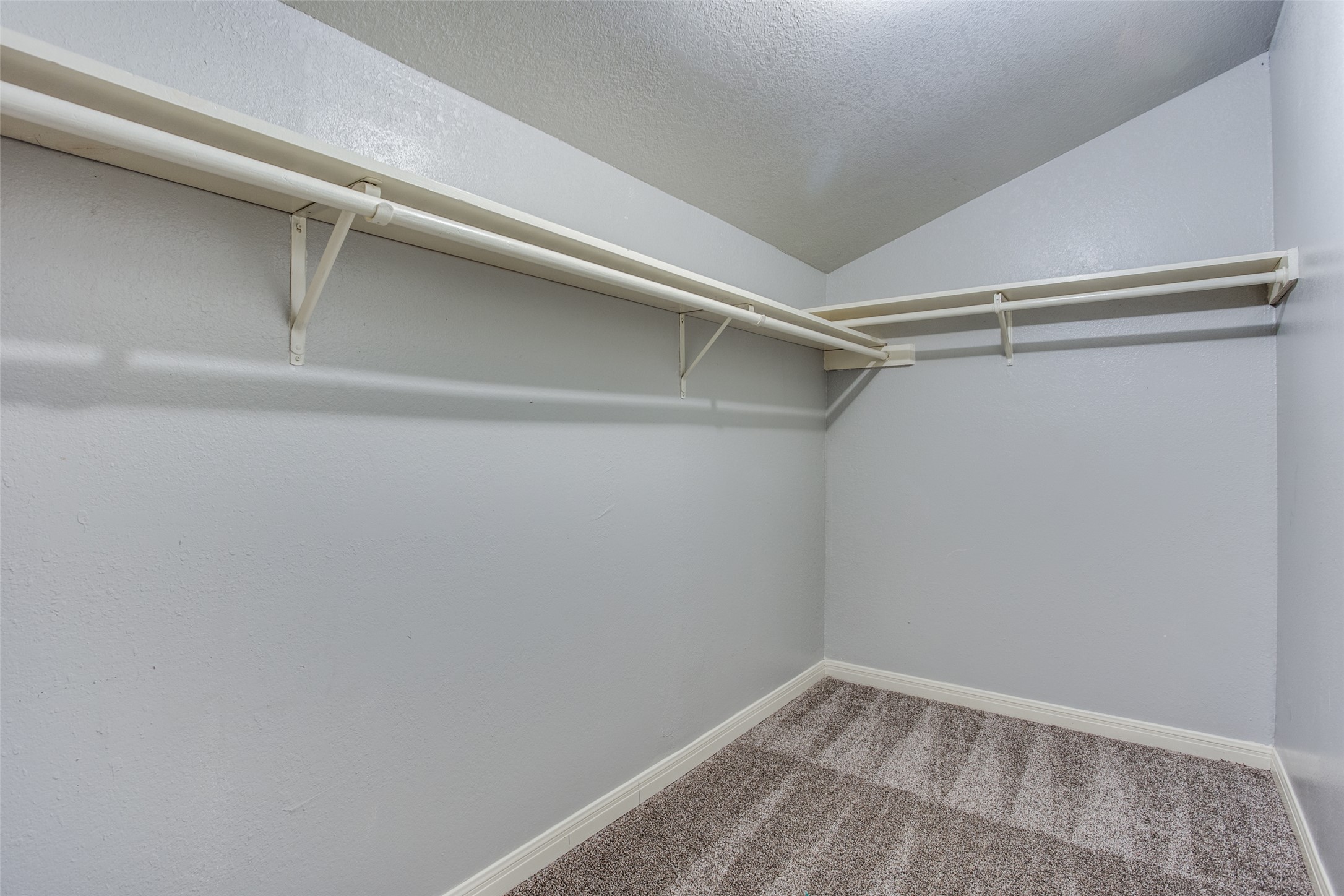 106 Verna Spur, Unit B Georgetown, TX 78628 - Photo 16 of 25 Ample hanging space and shelving create a well-organized closet.