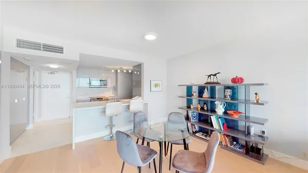 a living room with lots of furniture and clutter