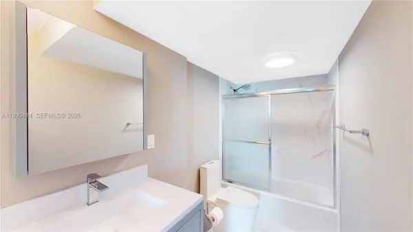 a bathroom with a bathtub and a sink