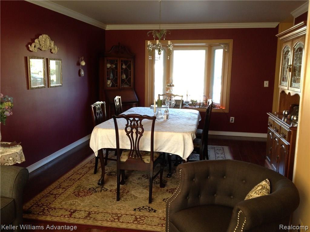 42733 Keystone Canton, MI 48187 - Photo 13 of 34 LIVING ROOM CURRENTLY USED AS DINING ROOM WITH BAY WINDOW FEATURED.