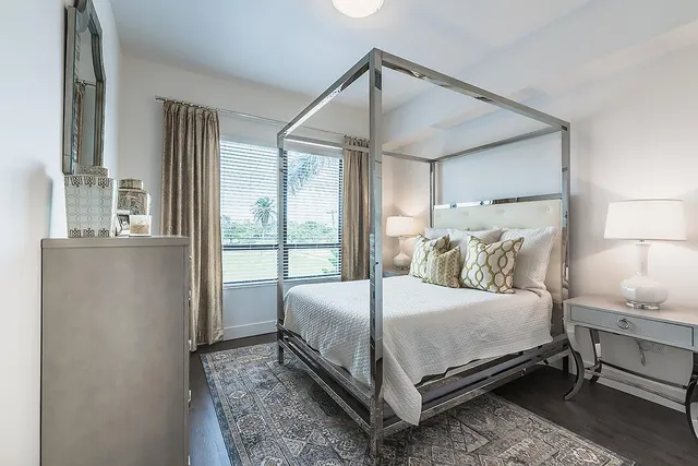 a bedroom with a bed and window