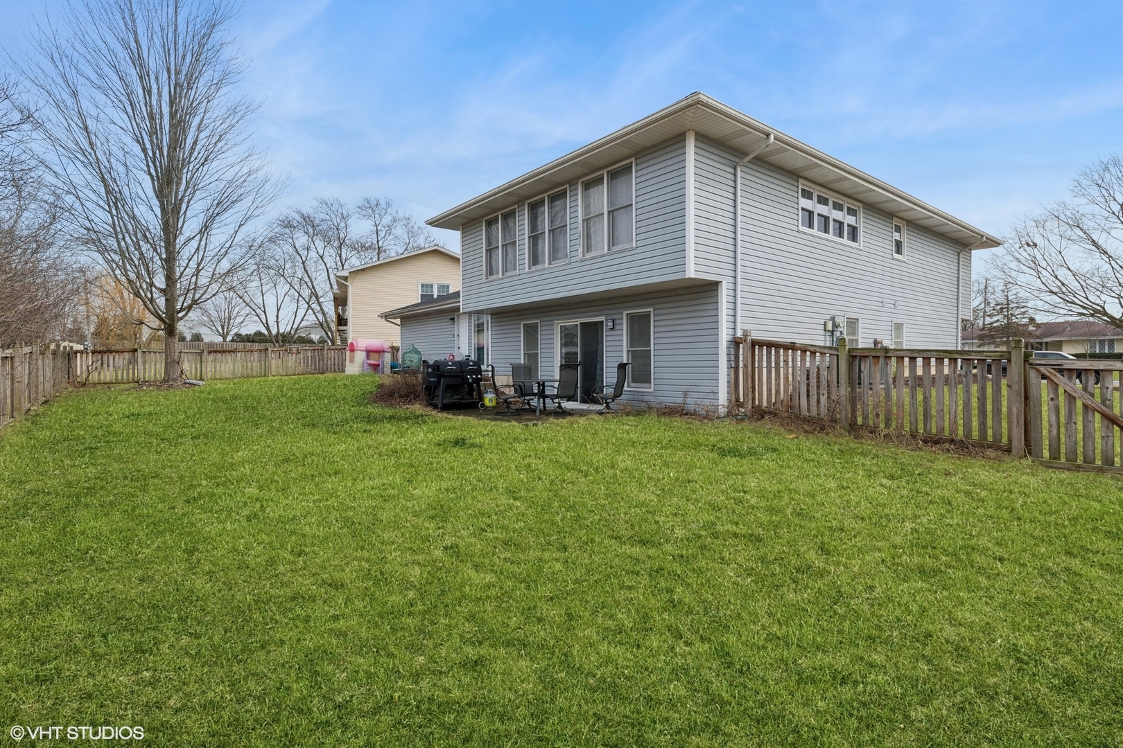 1285 Fairmont Road Hoffman Estates, IL 60169 - Photo 21 of 21 a front view of a house with a yard and trees