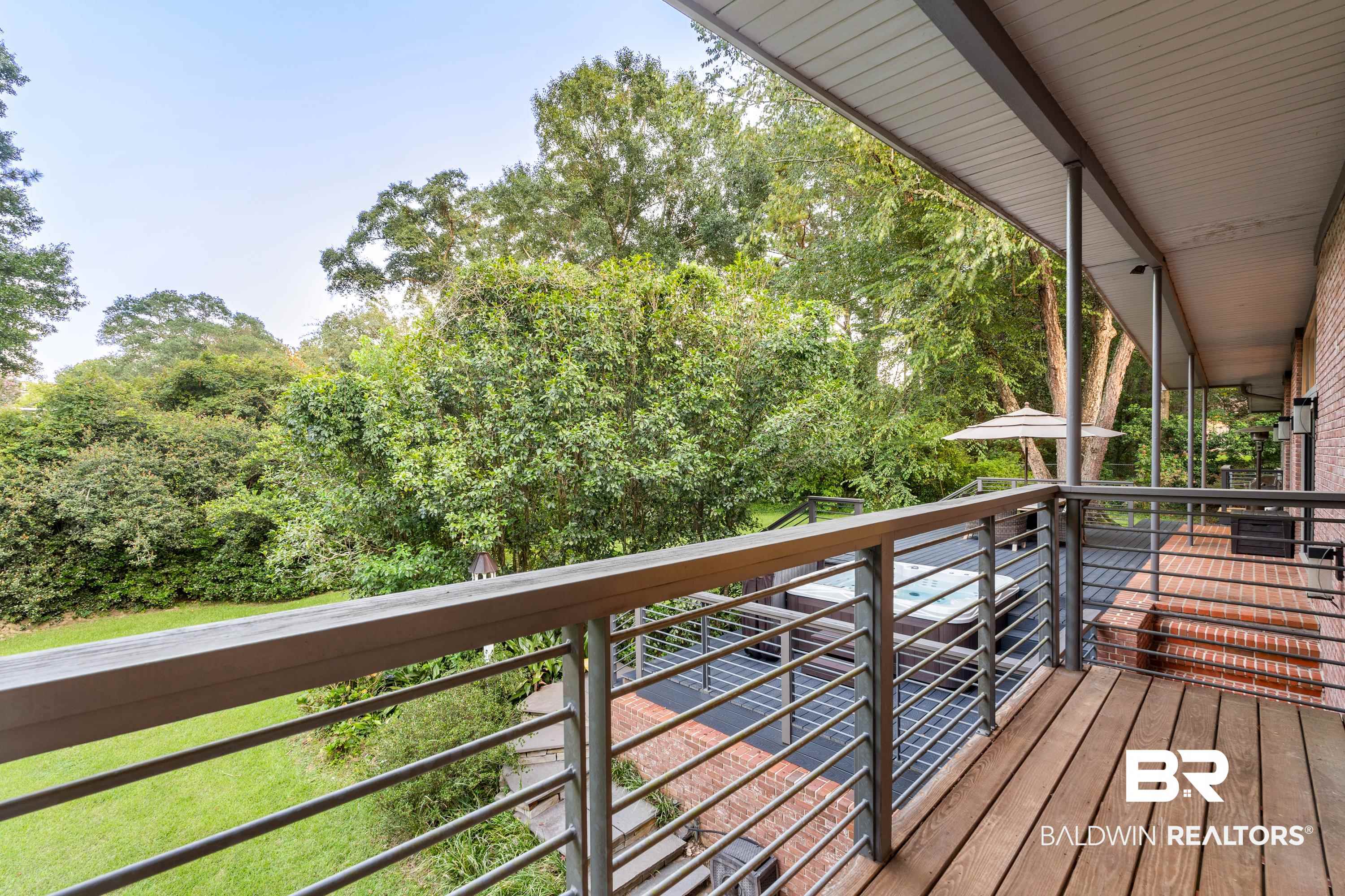 233 Suzanne Circle Mobile, AL 36608 - Photo 21 of 85 Wooden deck featuring view of wooded area