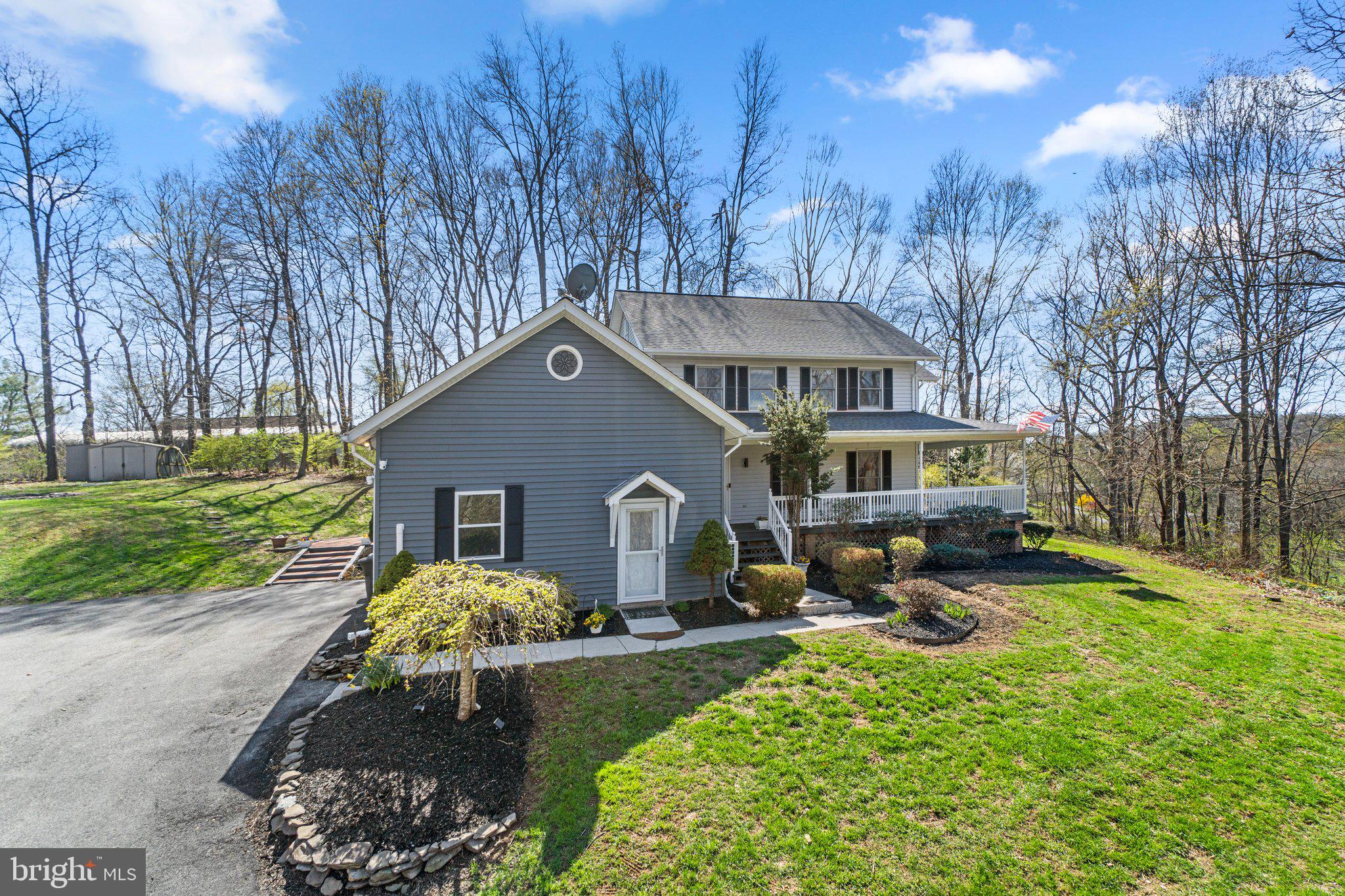4701 Gross Mill Road Hampstead, MD 21074 - Photo 1 of 62 a front view of a house with garden